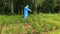 Farmer using pesticide sprayer to protect potato harvest