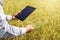 farmer using tablet technology inspecting rice growing