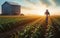 Farmer walking through cornfield at sunset