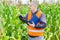 Farmer walks through corn field