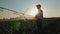 Farmer watching the irrigation cornfield