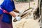 Farmer winnowing rice.