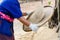 Farmer winnowing rice.