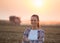 Farmer woman with crossed arms at corn harvest