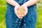 Farmer woman cupped hands pour seeds,whole wheat grain kernels.planting and feeding, harvesting on the farm. Spring and summer