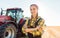 Farmer woman driving a tractor