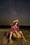 Farmer woman with her basket under starry sky
