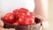 Farmer woman holding fresh picked tomatoes, close-up