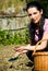 Farmer woman holding soil