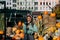 Farmer woman sells autumn pumpkin harvest at the market