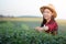 Farmer woman thinking something at tea plantation