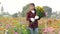 Farmers check the quality of flowers before delivering to customers