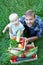 Farmers family. Father and his toddler son picking vegetables. A