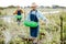 Farmers feeding snails on the field