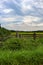 Farmers fence with wagon in field 2