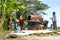 Farmers are grinding rice with a mobile rice milling machine.