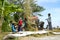 Farmers are grinding rice with a mobile rice milling machine.