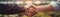 Farmers Handshake Against Backdrop Of Unfocused Agriculture With Cows, Closeup Panoramic Banner