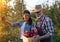 Farmers harvesting apples in orchard