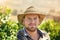 Farmers have the most important jobs there is. a middle-aged farmer posing on a vineyard.