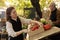 Farmers market vendor preparing fresh organic produce stall