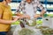 Farmers standing near the table and packing greens