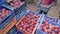 Farmers team stacks boxes of ripe peaches in the summer garden