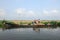 Farmers transport the gunny bags containing the harvested rice in a wooden boat