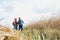 Farmers walking while talking against wheat field