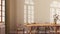 Farmhouse dining room with wooden table and chairs in yellow and beige tones. Plaster walls, boho interior design