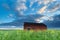 Farmhouse on flowering meadow