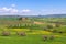 Farmhouse, green hills,cypress trees in Tuscany