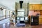 Farmhouse kitchen room with antique stove and brick background w