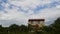 Farmhouse rural landscape with clouds above