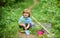 Farming and agriculture cultivation. small kid gardener planting a flower. human and nature. earth day. Eco life. summer