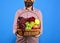 Farming and autumn crops concept. Male hands hold basket