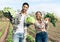 Farming, harvest and interracial couple with vegetables from their sustainable, agro and agriculture farm