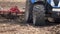 Farming: plowing. Tractor in a field followed by flying birds