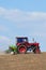 Farming tractor plowing