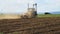 Farming. The Tractor Plows the Land.