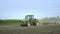 Farming tractor preparing land for sowing. Agricultural technology