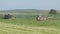 Farming tractors moving on agricultural field for harvesting land. Agricultural machinery on harvesting field