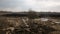 Farmland aerial view with a tractor plowing soil