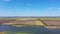 Farmland bird\'s eye view. Farm by the pond