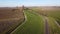 Farmland with farmer\\\'s farm. Drone aerial view panarama sight. Winter with landscape resting for the new season.