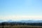 Farmland, forest and mountain landscape