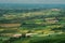 Farmland with green grass field in county Tipperary, Ireland. Stunning Irish landscape scene. Blue cloudy sky. View from a high