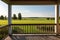 farmland horizon seen from porch of traditional farmhouse