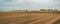 Farmland and wind farm in a September cloudy day