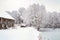 Farms and Farmhouses in the Snow. Windmill. Agriculture and Rural Life at Winter Background.